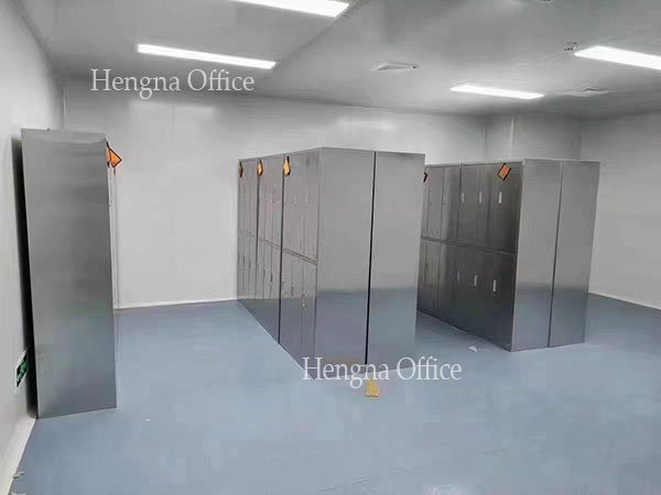 New stainless steel lockers replacing old corroded units in workplace facility