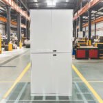 Steel lockers in factory locker room with individual keyed locks for employee storage